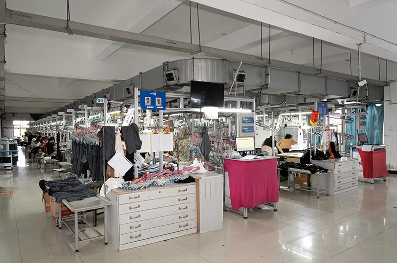Spacious garment manufacturing floor with multiple sewing stations