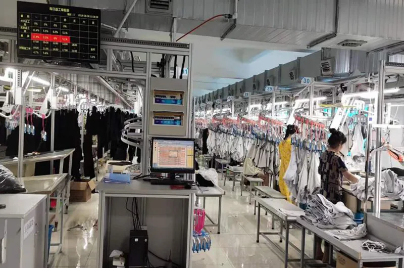 Modern sewing production line with digital management displays